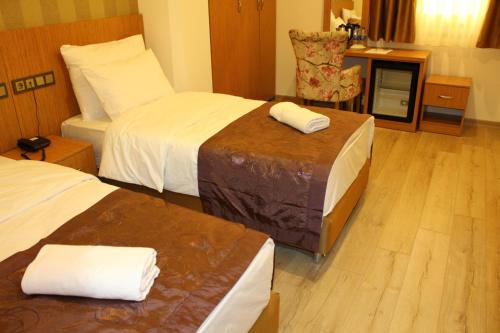 Melidium Hotelにあるベッド