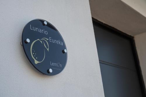 a sign on the side of a building at LEMON SUITES APARTMENTS in Rome