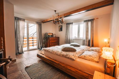 a bedroom with a large bed and a window at Posest Kunigunda in Šmartno v Rožni Dolini