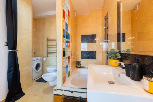 a bathroom with a sink and a toilet and a shower at BNB Slovakia Royal City Vista Apartment in Bratislava