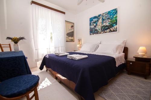 a bedroom with a bed with two towels on it at Holiday Home ART - Bol in Bol
