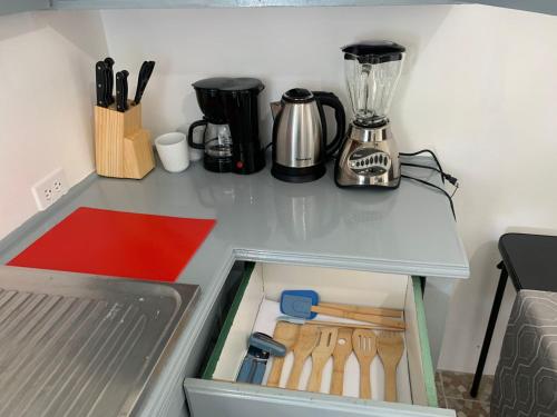 a drawer in a refrigerator with a blender at Lovely Studio Apt in Whim Estate-near Scarborough in Scarborough