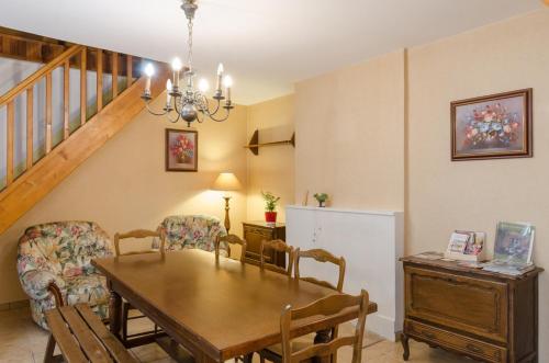 a dining room with a table and chairs at Chez albertine in Spoy