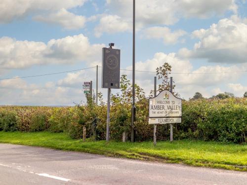 a sign on the side of a road near a field at 1 Bed in Turnditch PK919 in Turnditch