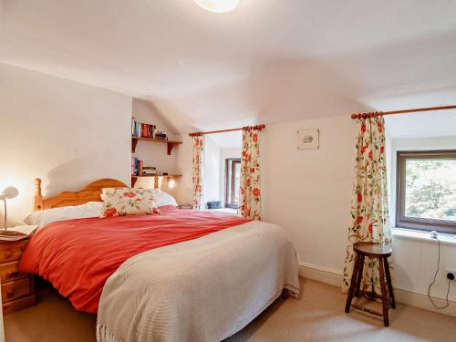 a bedroom with a large bed and a window at 1 bed property in Trefriw North Wales 54752 in Trefriw