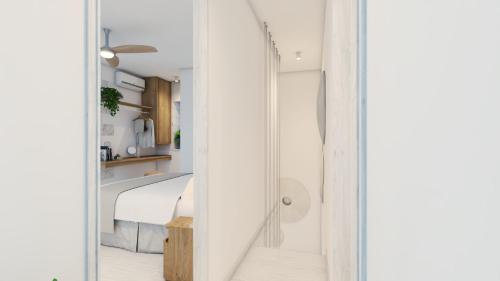 a room with a glass door leading to a bedroom at Heniochos Villas in Chania Town