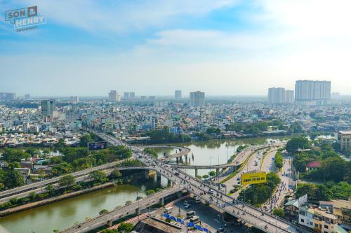 a large city with a bridge over a river at Son&Henry Zenity District 1 in Ho Chi Minh City