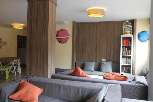a living room with a couch and a book shelf at Rey Mundo in Munébrega
