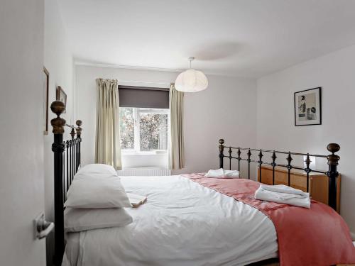 a bedroom with a large bed with two pillows at 3 Bed in Nr Embleton CN156 in North Charlton