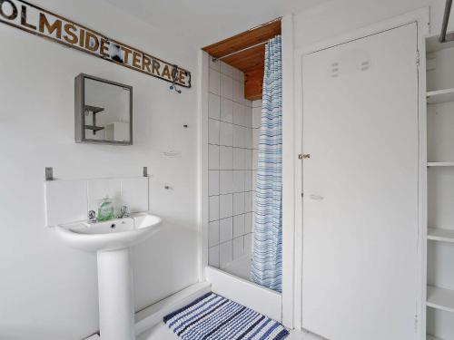 a bathroom with a sink and a shower at 3 Bed in Nr Embleton CN156 in North Charlton