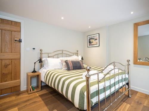 a bedroom with a bed and a wooden floor at 3 Bed in North York Moors National Park G0174 in Rosedale Abbey