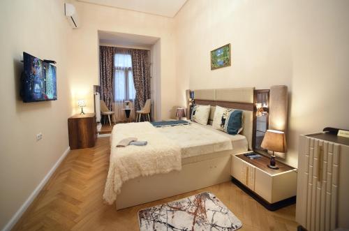 a bedroom with a large bed in a room at City Lux Hotel in Tbilisi City