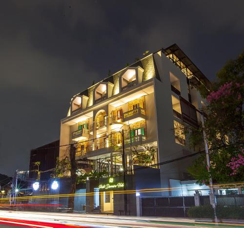 a building at night with a street in front of it at Posto Dormire Sudirman in Jakarta