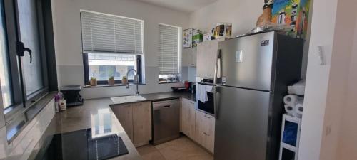 Η κουζίνα ή μικρή κουζίνα στο JTower Royal Suites - Alefimmoed