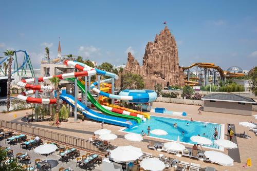 a water park with a pool and a water slide at Aydinbey Queen’s Palace & SPA in Belek