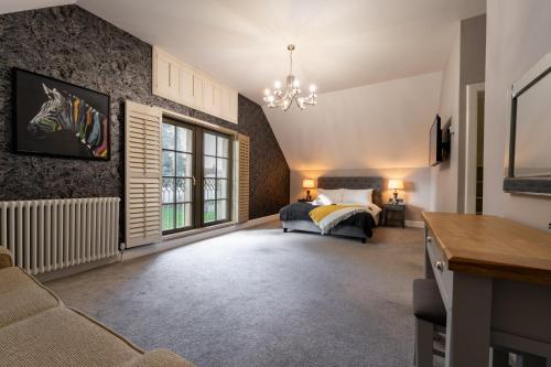 a bedroom with a bed and a window at Escape Ordinary at Lough Erne Golf Village in Enniskillen