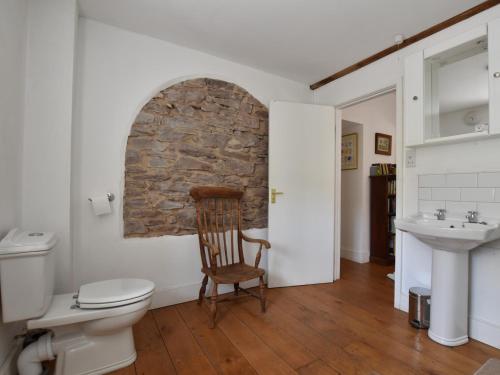 a bathroom with a toilet and a sink at 4 Bed in Hay-on-Wye Town BN116 in Hay-on-Wye