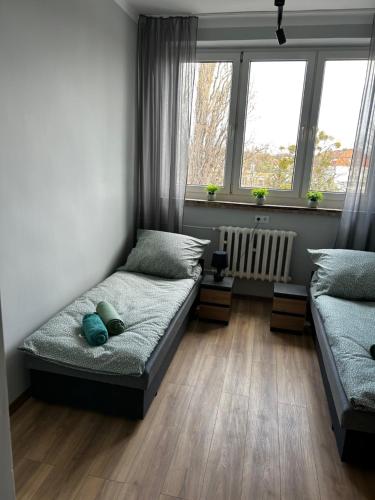 Ένα ή περισσότερα κρεβάτια σε δωμάτιο στο CZARNA PERŁA