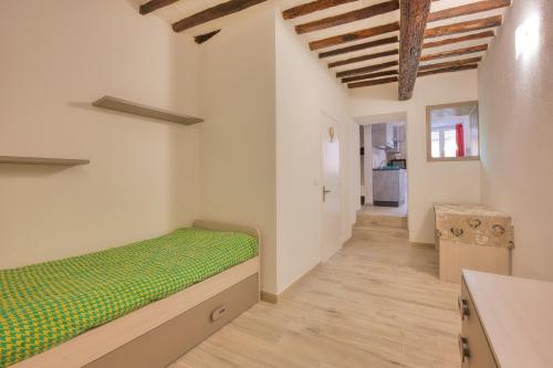 Ένα ή περισσότερα κρεβάτια σε δωμάτιο στο La Casetta di Concetta - Goelba