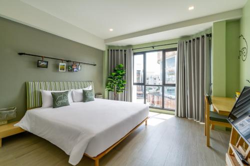 Chamemon Bed Phuket Townにあるベッド