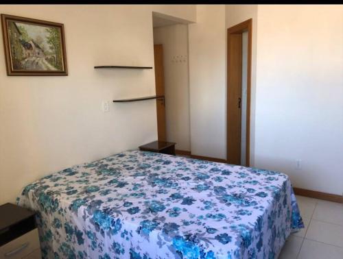 Katil atau katil-katil dalam bilik di Apartamento em Tramandai/RS
