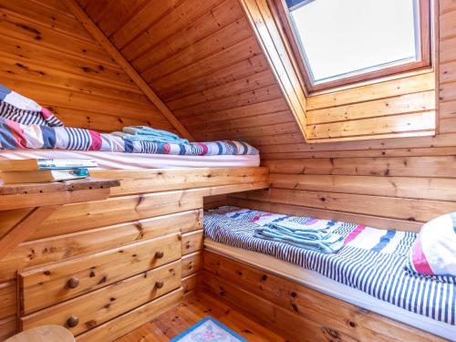 two beds in a sauna in a log cabin at 3 Bed in Clovelly 00367 in Clovelly