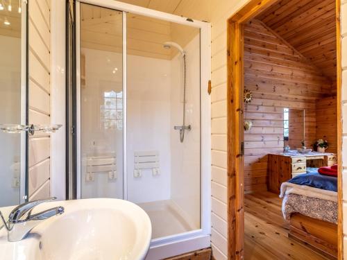 a bathroom with a shower and a sink at 1 Bed in Clovelly 00354 in Clovelly