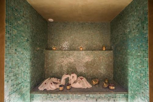 a room with several pairs of shoes on a shelf at JEMAA EL FNA Suites & Spa in Marrakech