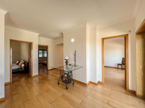 an empty living room with a glass table in it at The Ocean View Villa in Viana do Castelo