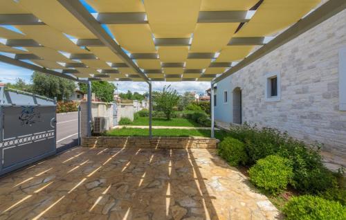 a pergola over a patio of a building at Villa Lory in Vabriga