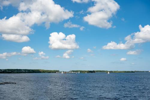 a large body of water with boats on it at Veerse Wende in Arnemuiden