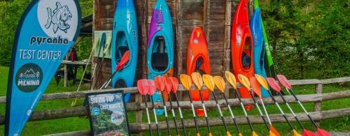 a display of colorful scissors on a wooden fence at Bed & Breakfast Dvorec in Petrovče