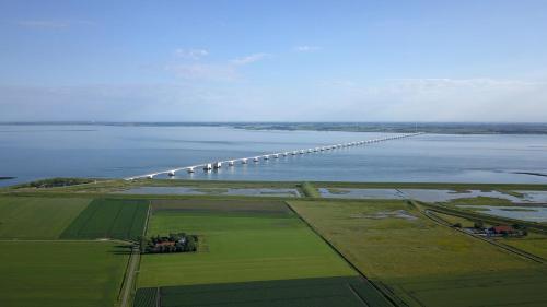 an aerial view of a bridge over a body of water at Camping 'de Val' in Zierikzee