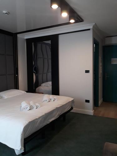 Postel nebo postele na pokoji v ubytování Hotel Celis