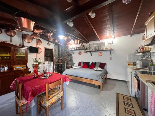 a bedroom with a bed and a table in it at La Baita Di San Massimo in Rapallo