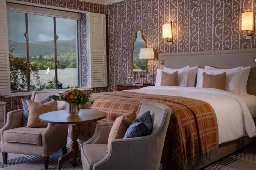 a hotel room with a large bed and a window at Langdale Chase Hotel in Windermere