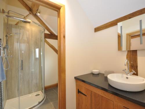 a bathroom with a sink and a shower at 3 Bed in Leominster 50513 in Pencombe