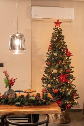a christmas tree on top of a table at Sezian Boutique Homes and Villas in Preveza