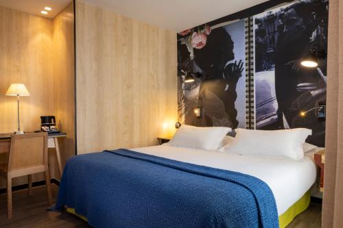 Ein Bett oder Betten in einem Zimmer der Unterkunft Hotel L’Antoine