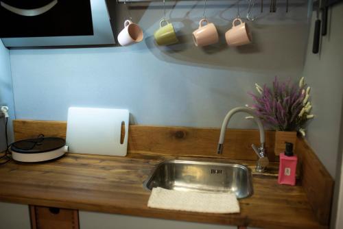 a kitchen counter top with a sink and a sink at Apartament 33 Skawina in Skawina
