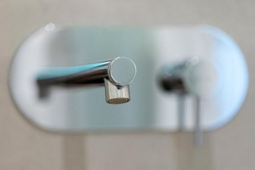 a close up of a toothbrush in a faucet at FUTURA ROOM&RELAX in Termoli