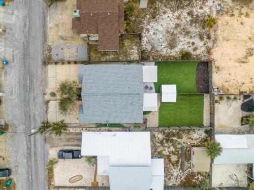 an overhead view of a yard with houses at Blue Neptune at 5313 Sunset Avenue by Nautical Properties Vacation Rentals in Panama City Beach