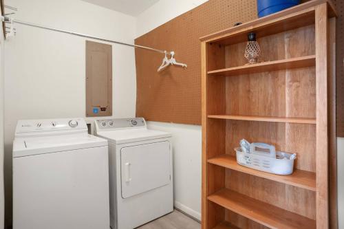 a laundry room with a washing machine and a shelf at Fripp Island 702 Tautog in Fripp Island