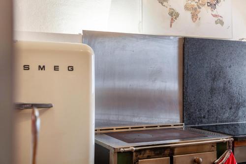 a kitchen with a stove and a refrigerator at Liberty Ranch Marlstein in Oetz