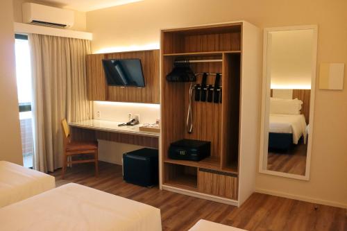 Postel nebo postele na pokoji v ubytování Quality Hotel Aracaju
