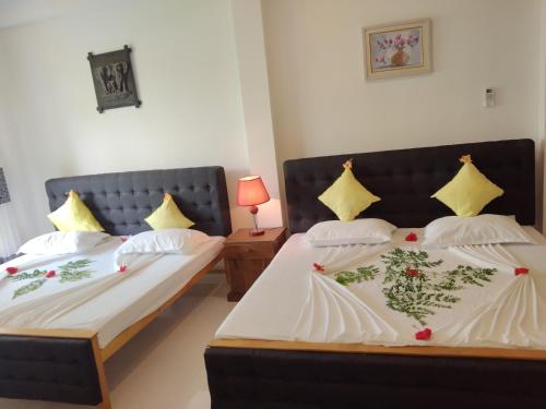 Postel nebo postele na pokoji v ubytování Hotel Sapid Luck Yala Safari