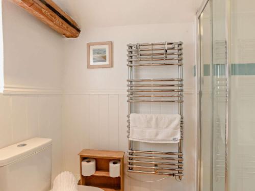 a bathroom with a towel rack next to a shower at 2 bed property in Gresham 75916 in Aylmerton