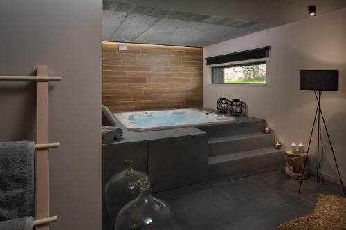 a bathroom with a jacuzzi tub in a room at Modern Villa Melon with outdoor pool in Porec in Krmenjak