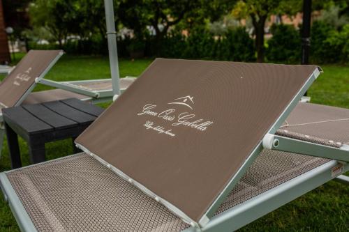 a couple of chairs sitting on the grass at Green Oasis Gabella in Castelforte