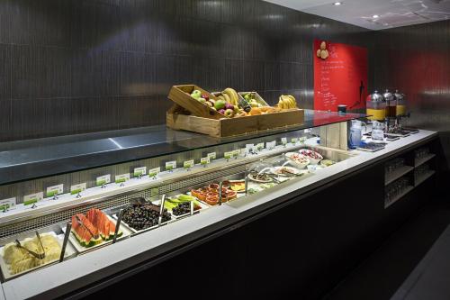 a buffet line with many different types of food at Hotel Grand Chancellor Townsville in Townsville